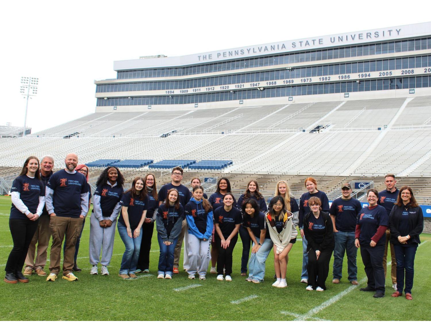 Students in Penn State's Lighthouse program post on the West Shore Home Field at Beaver Stadium.