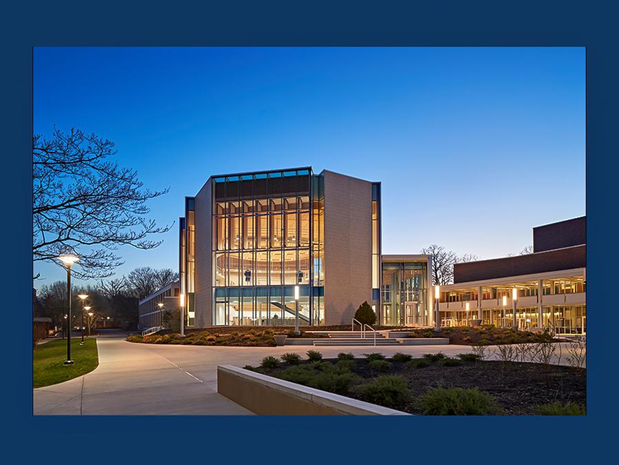 Recital Hall and Playhouse Theatre at dusk with the lights streaming from their windows