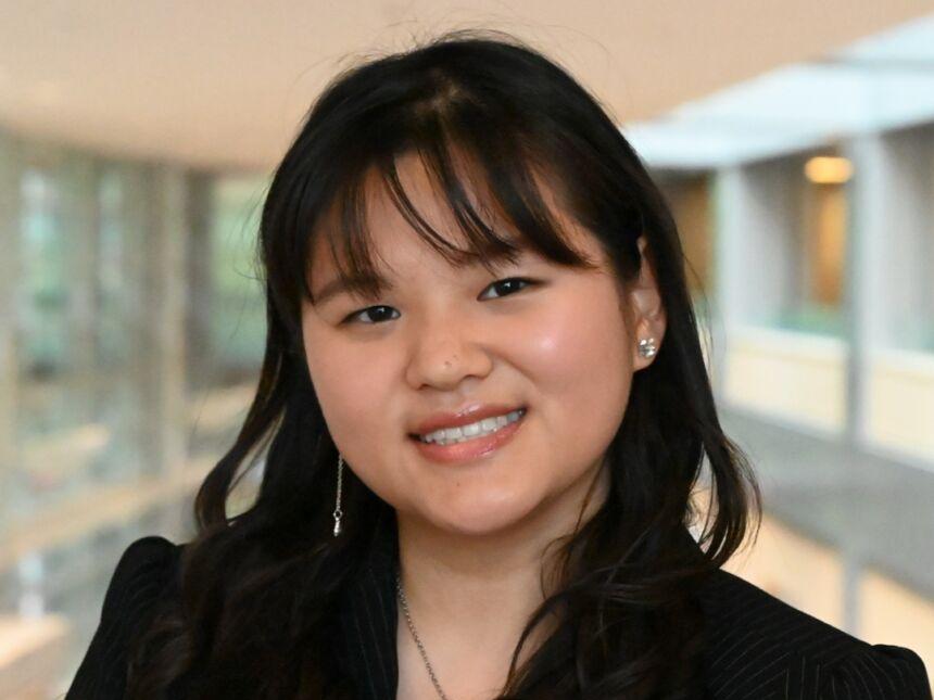 Young Asian woman with dark hair smiling