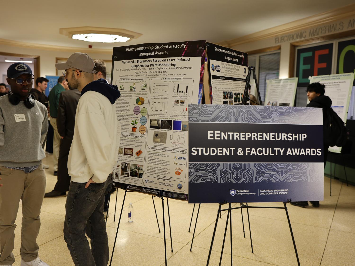 Presenters and attendees at the EEntrepreneur poster showcase during the 2026 Electrical Engineering Student Research Competition