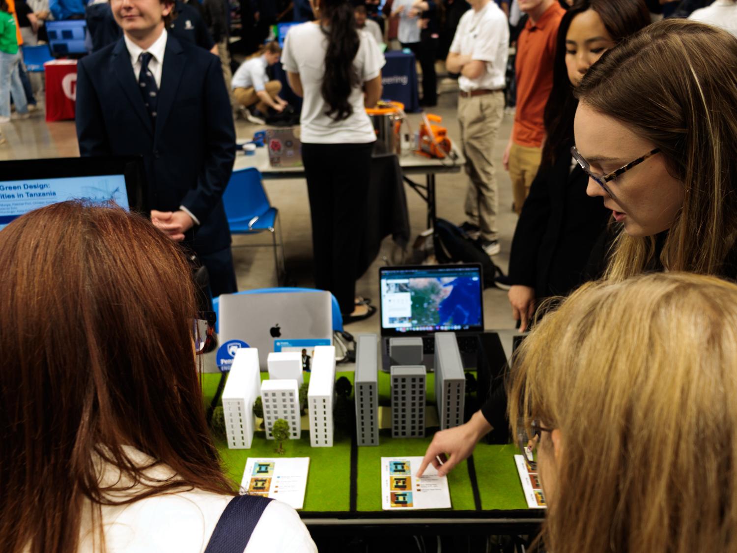 A student shows their civil engineering building work at the Spring 2026 Learning Factory Showcase in the Bryce Jordan Center.