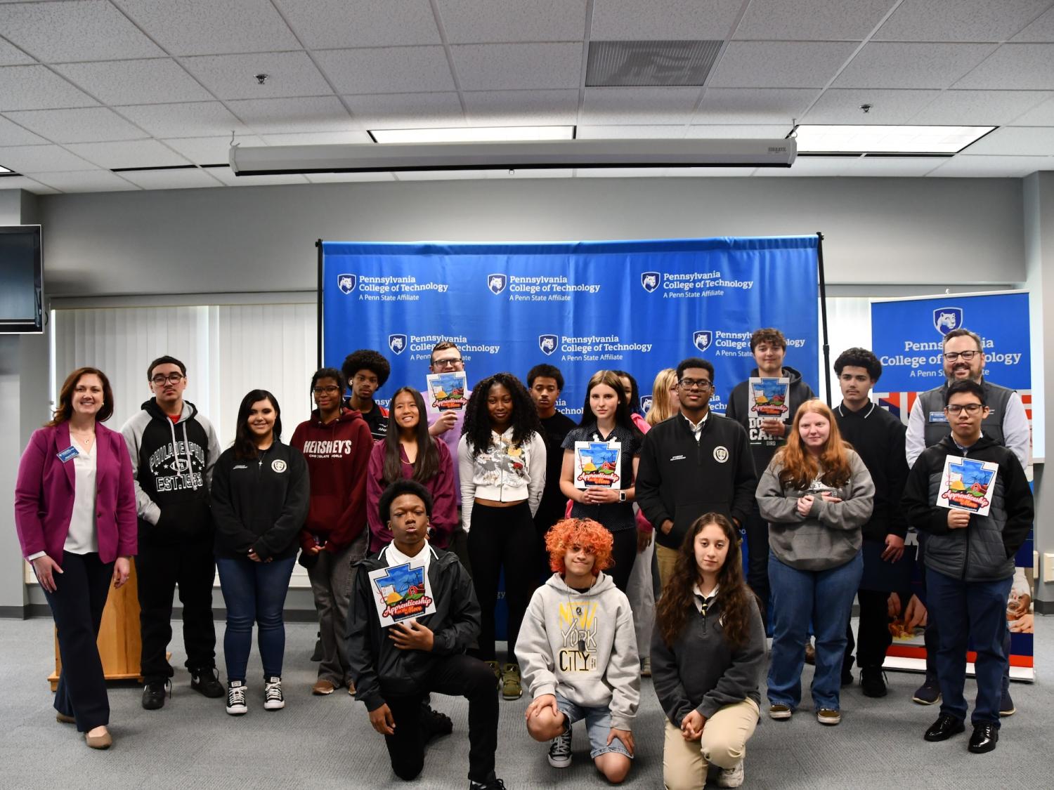 A large group of people pose for a photo.