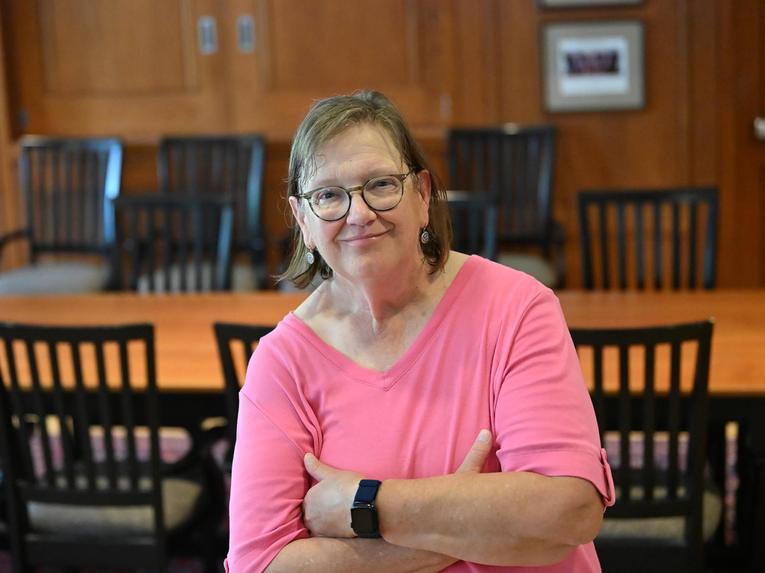 Woman posing in front of table