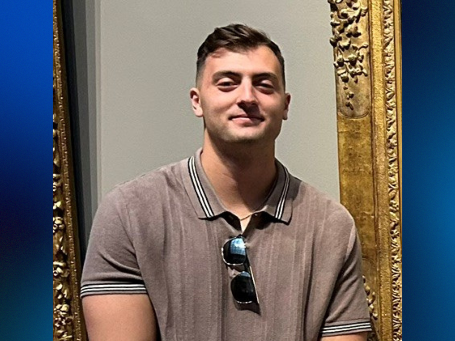 A man wearing a tan polo shirt.