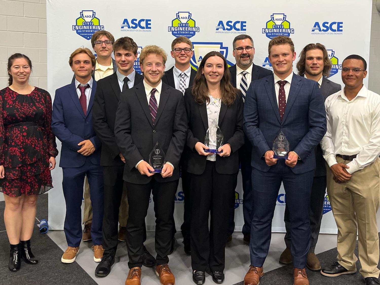 The Penn State Survey Club pose for a photo with their award.