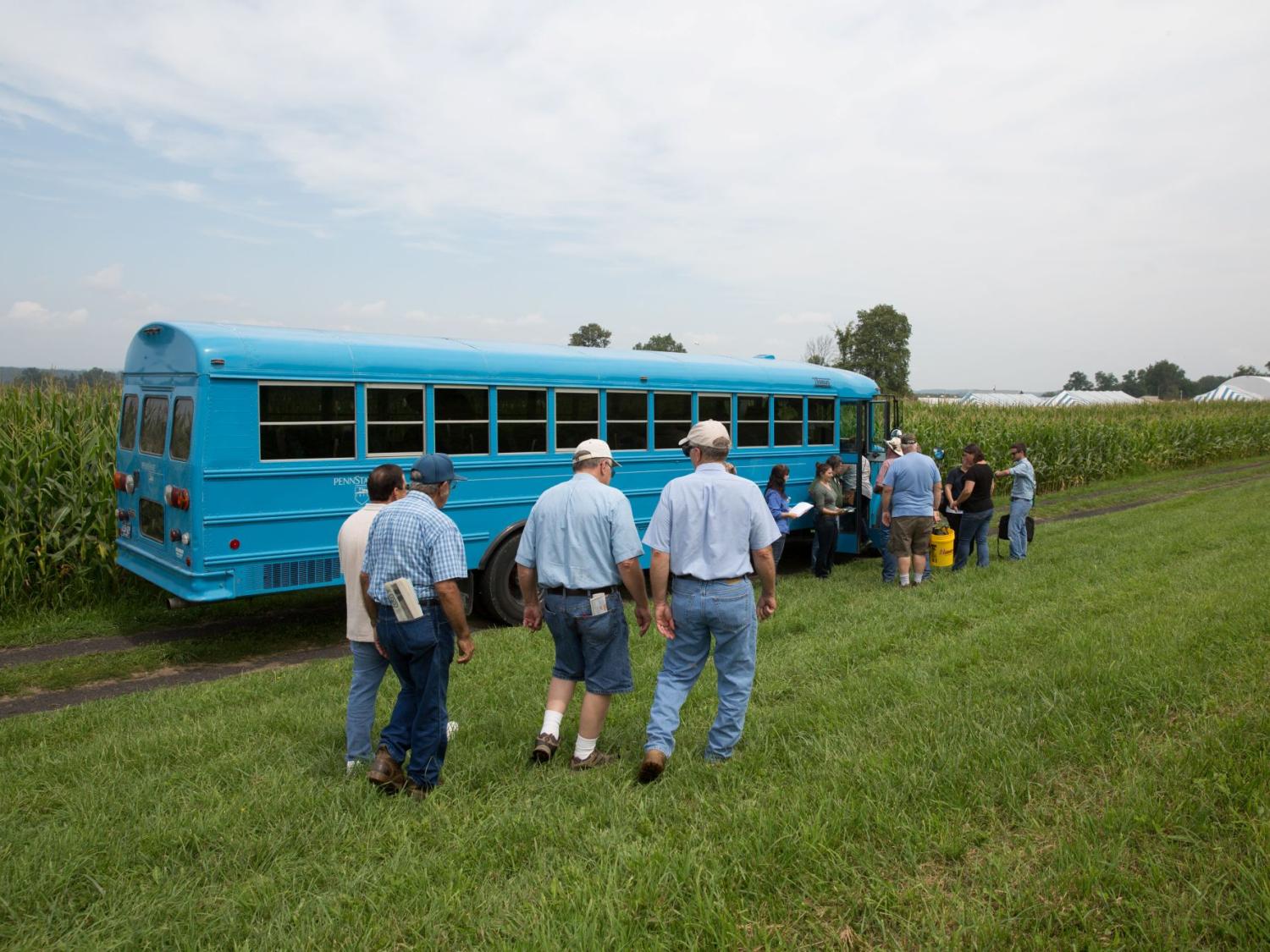 People getting on the tour bus at Ag Progress Days.