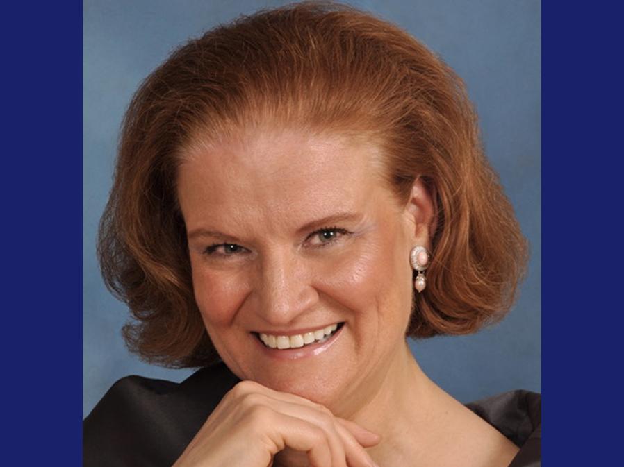 Woman with red hair smiling for a portrait photo