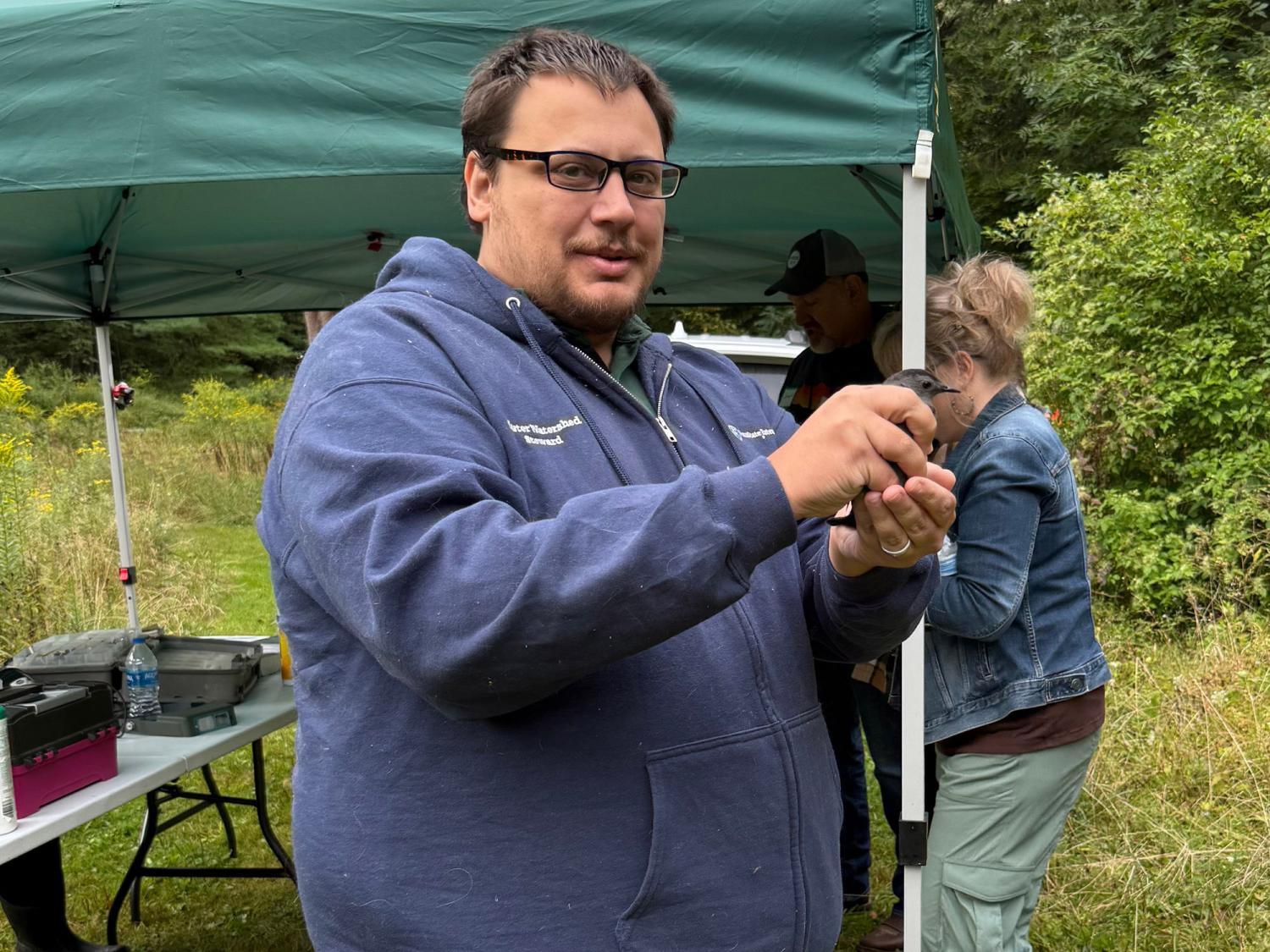 John Dubel, Master Watershed Steward, at a bird banding event.