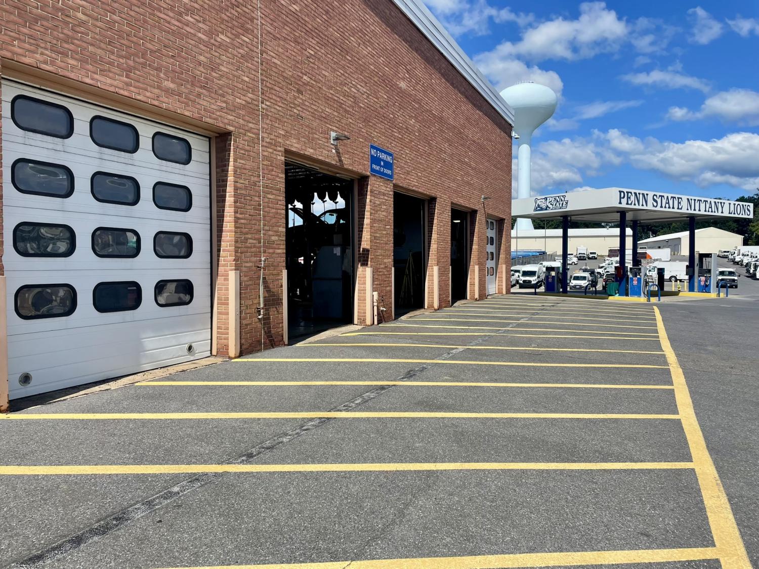 Service Garage showing five garage bays and the gas pumps