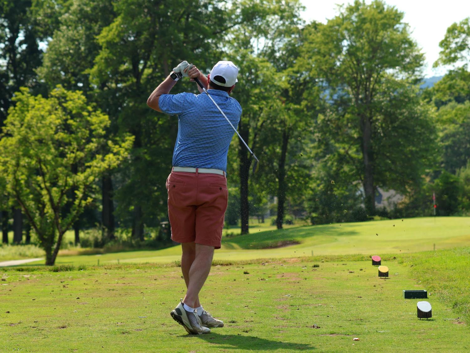 A person playing golf on a course