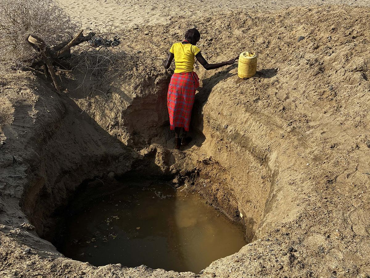Person stands in a well