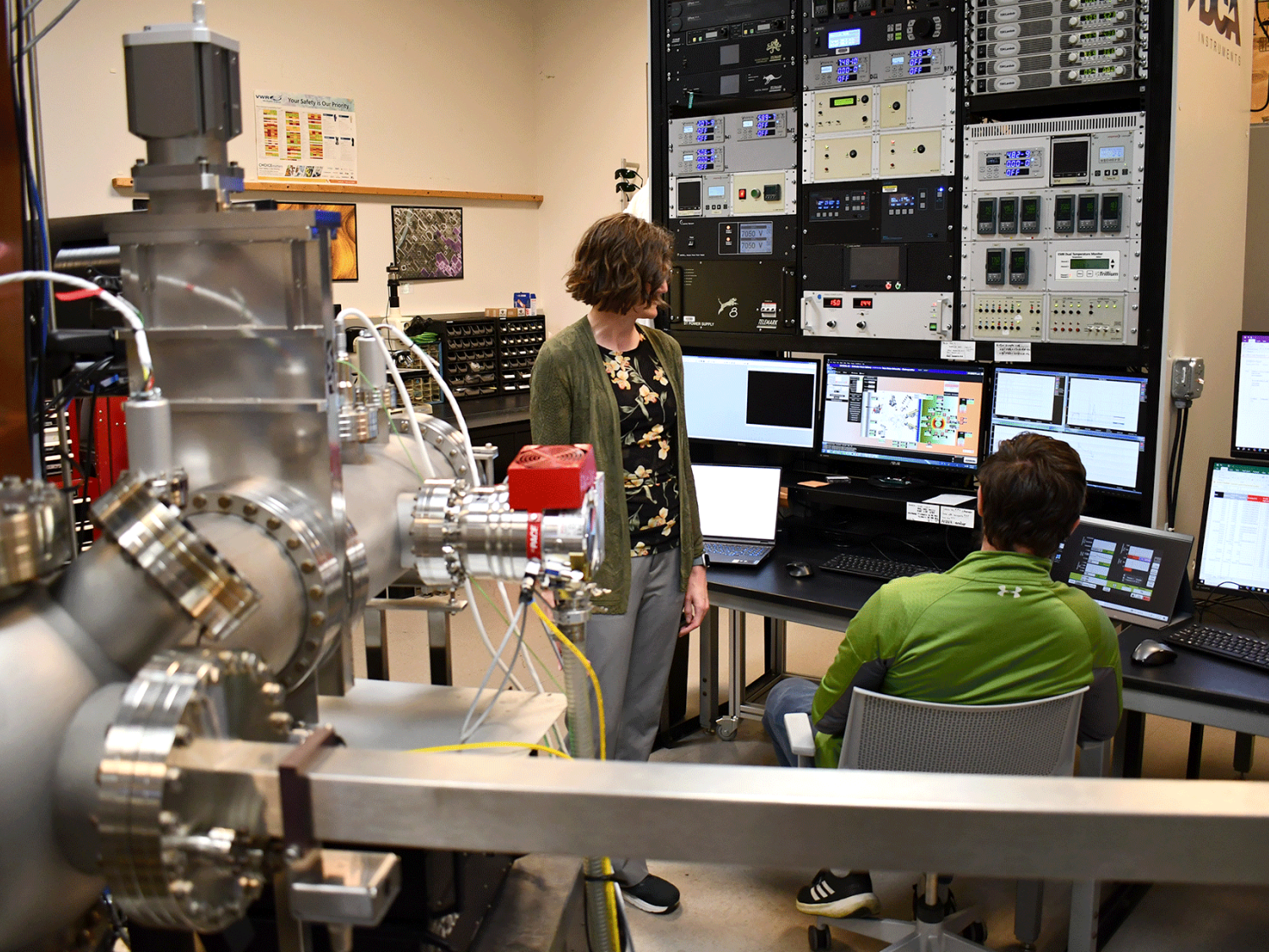 man and woman working in a physics lab