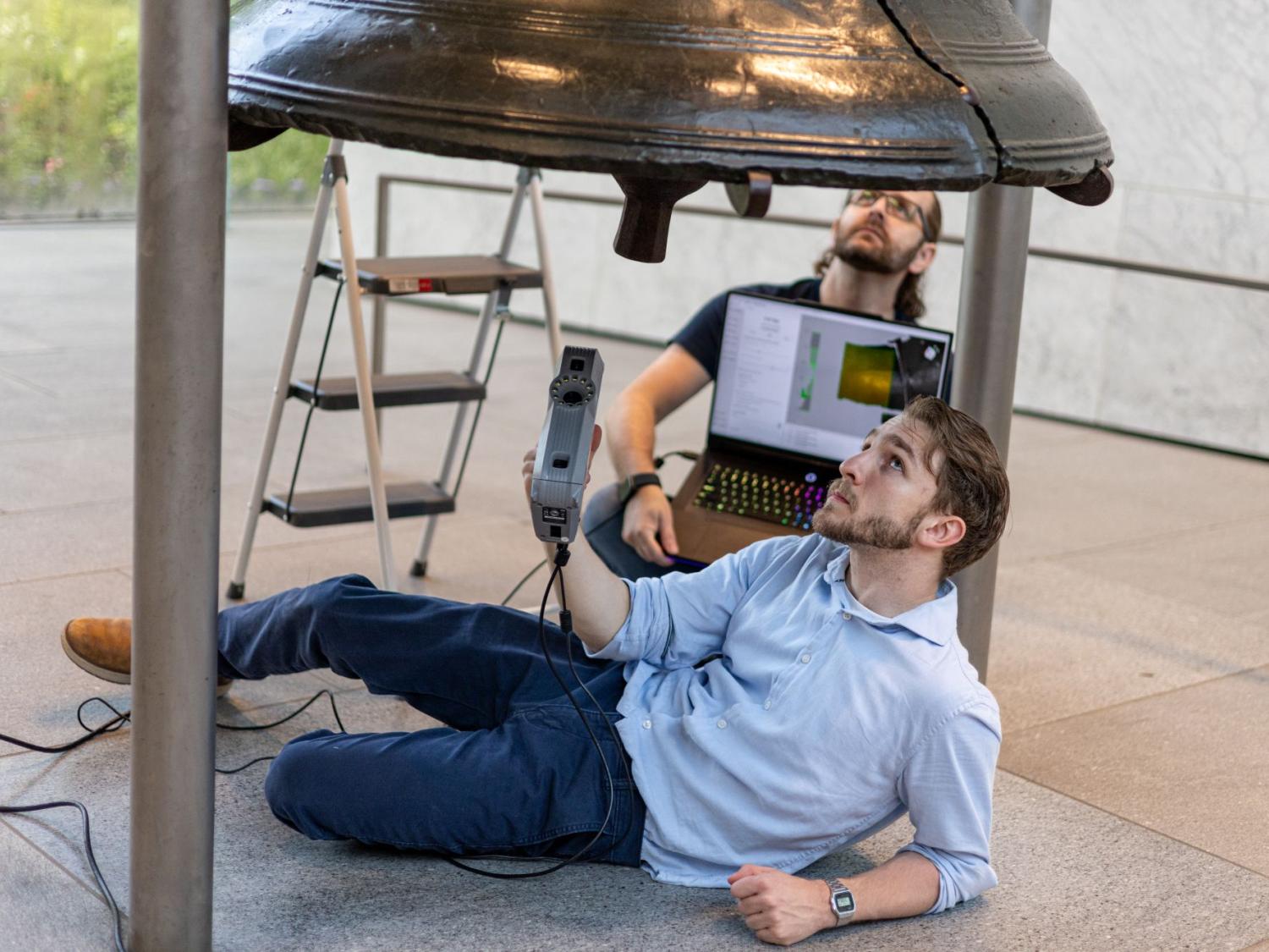 Penn State Behrend alumnus Remington Orange scans the Liberty Bell during a two-day research trip in June.