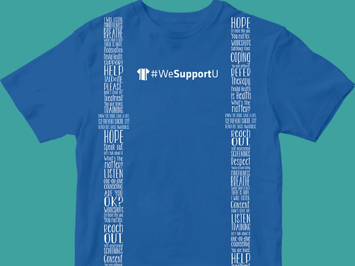 Blue T-shirt displaying #WeSupportU with white words about mental health, support, coping, therapy, and consent.