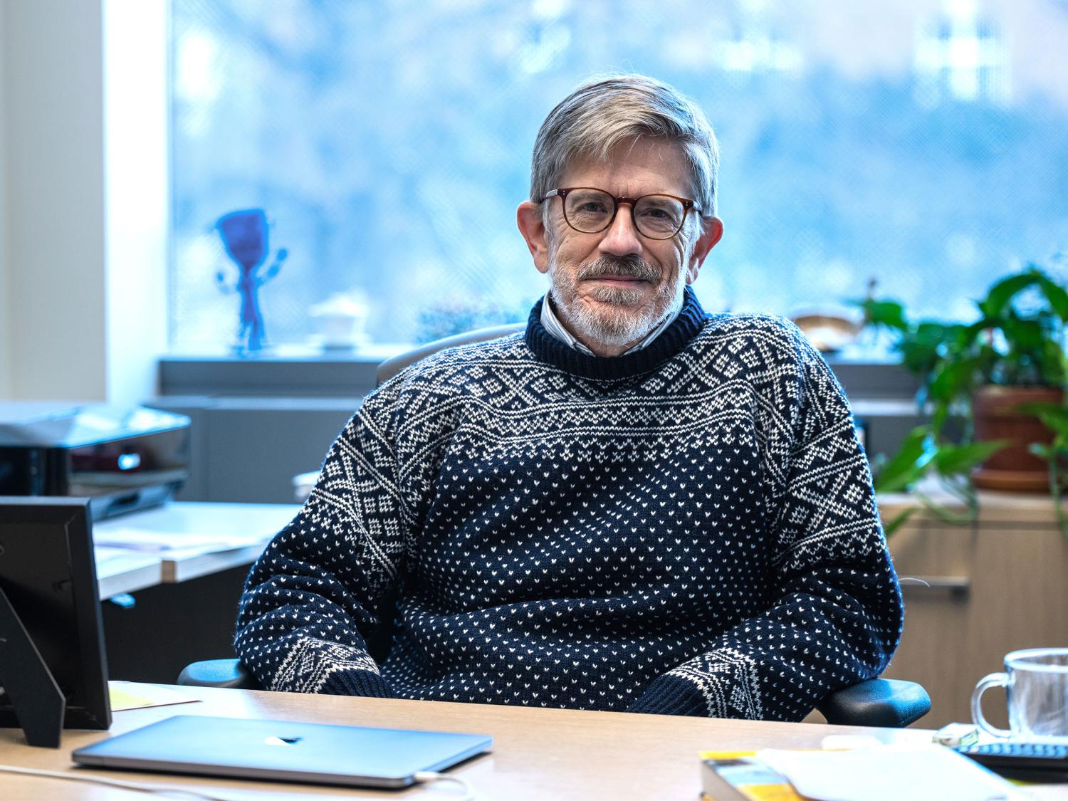 A photo of Scott Milner in his office. 