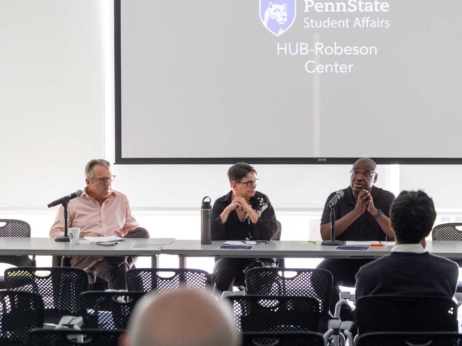 Panelists at the Department of History's America 250 event gather at a table