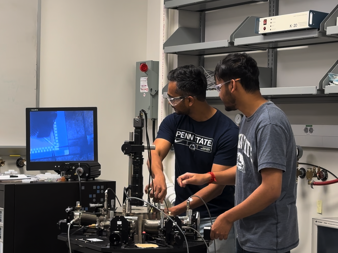 Two men running tests in a materials lab.