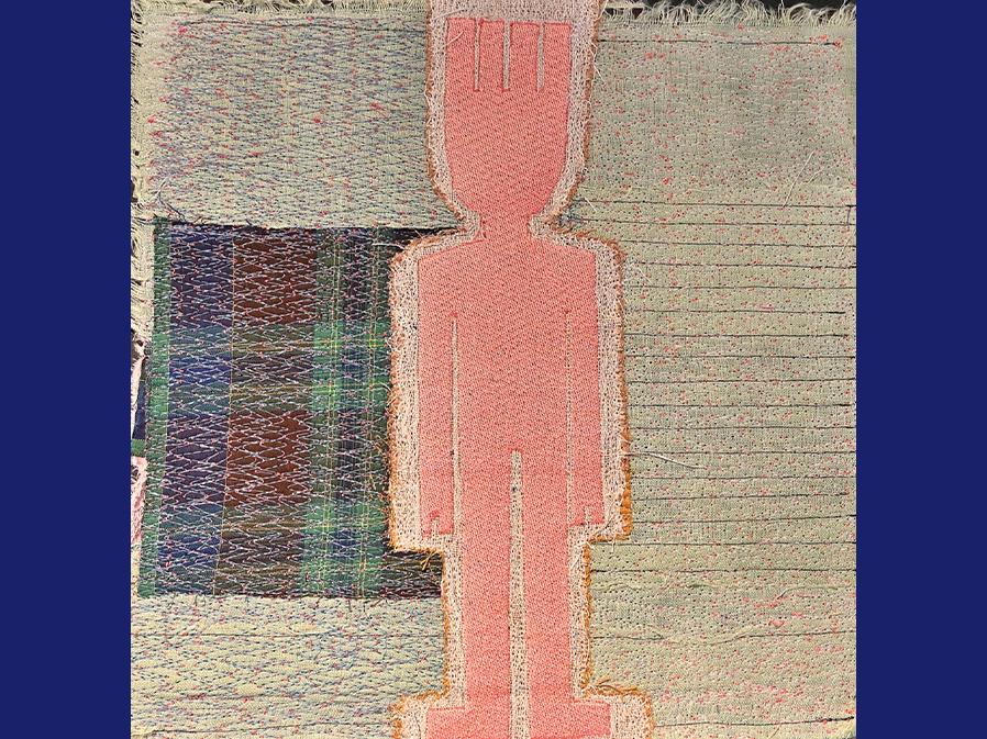 Outline of a human created with cut textiles and stitched to a fabric background