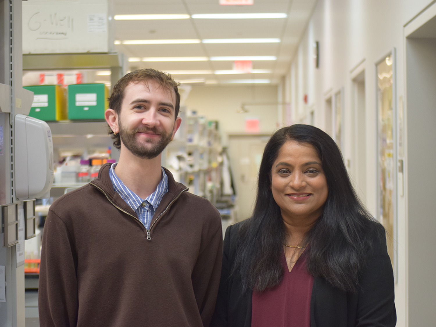 A man and a woman standing in a laboratory