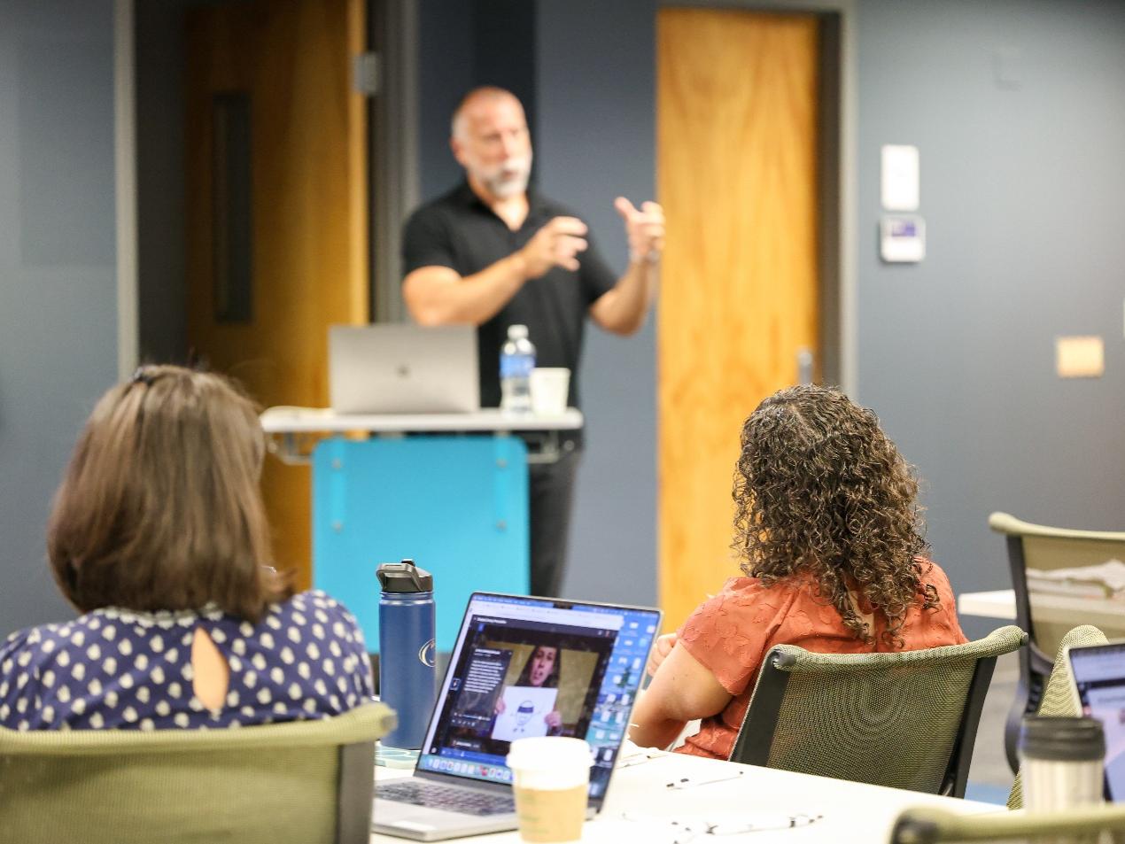 VoiceThread instructor presenting at a previous Learning Tools for Teaching event with faculty and staff members listening.