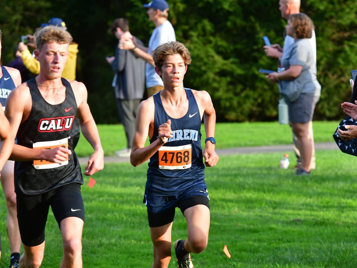 A Penn State Behrend runner competes in a cross-country race.