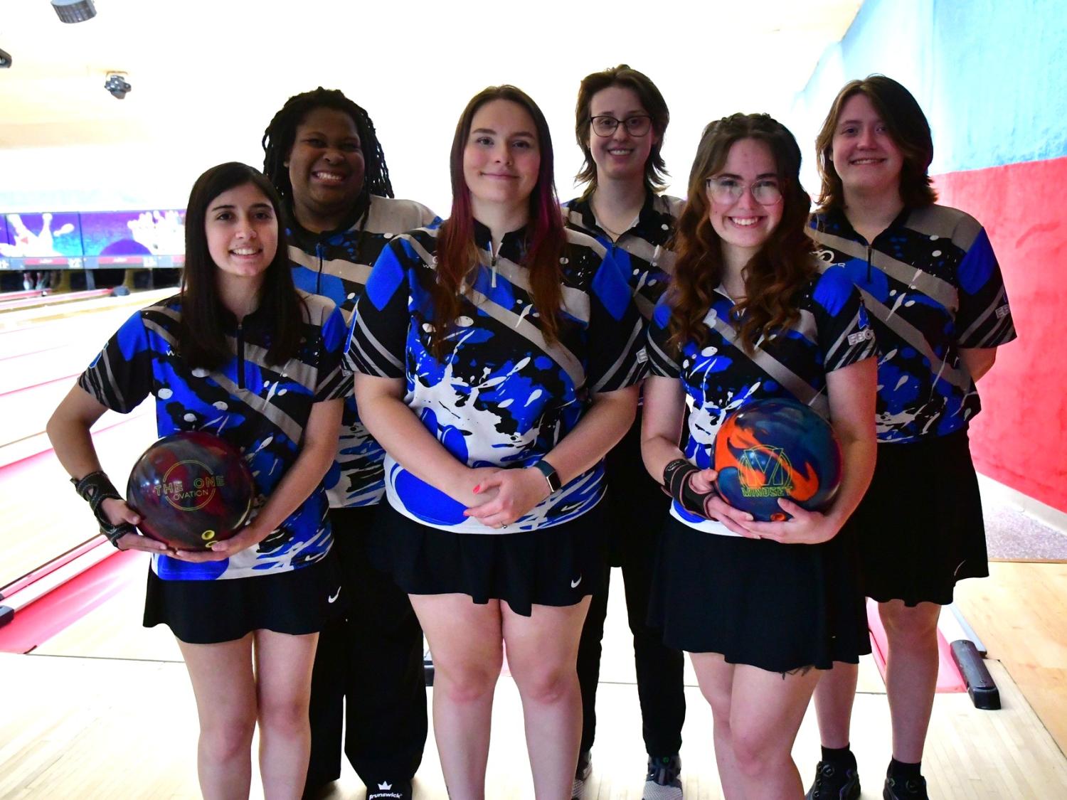 Members of the Penn State Behrend women's bowling team pose at a match.