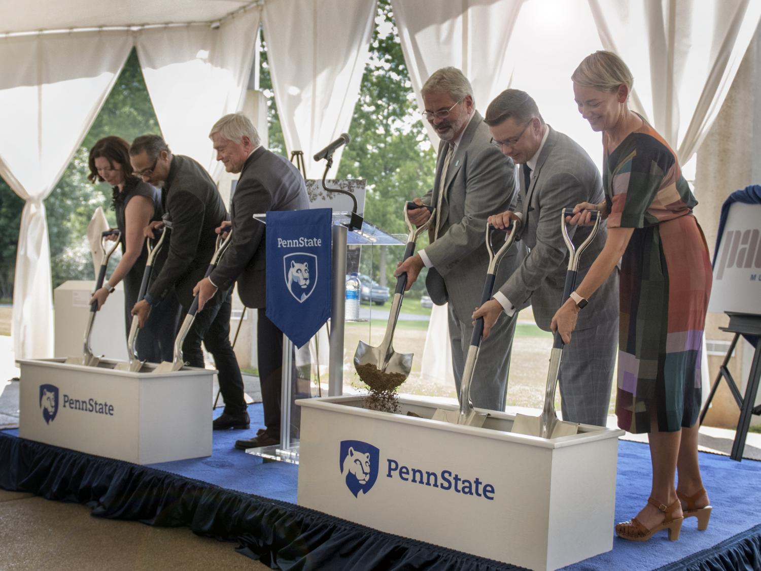 Six people participate in ceremonial groundbreaking for Palmer Museum of Art.