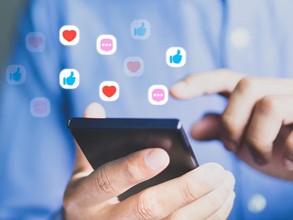 a man using his phone to access social media