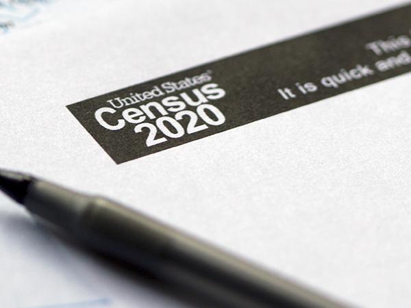 A pen laying on top of a copy of the 2020 Census.