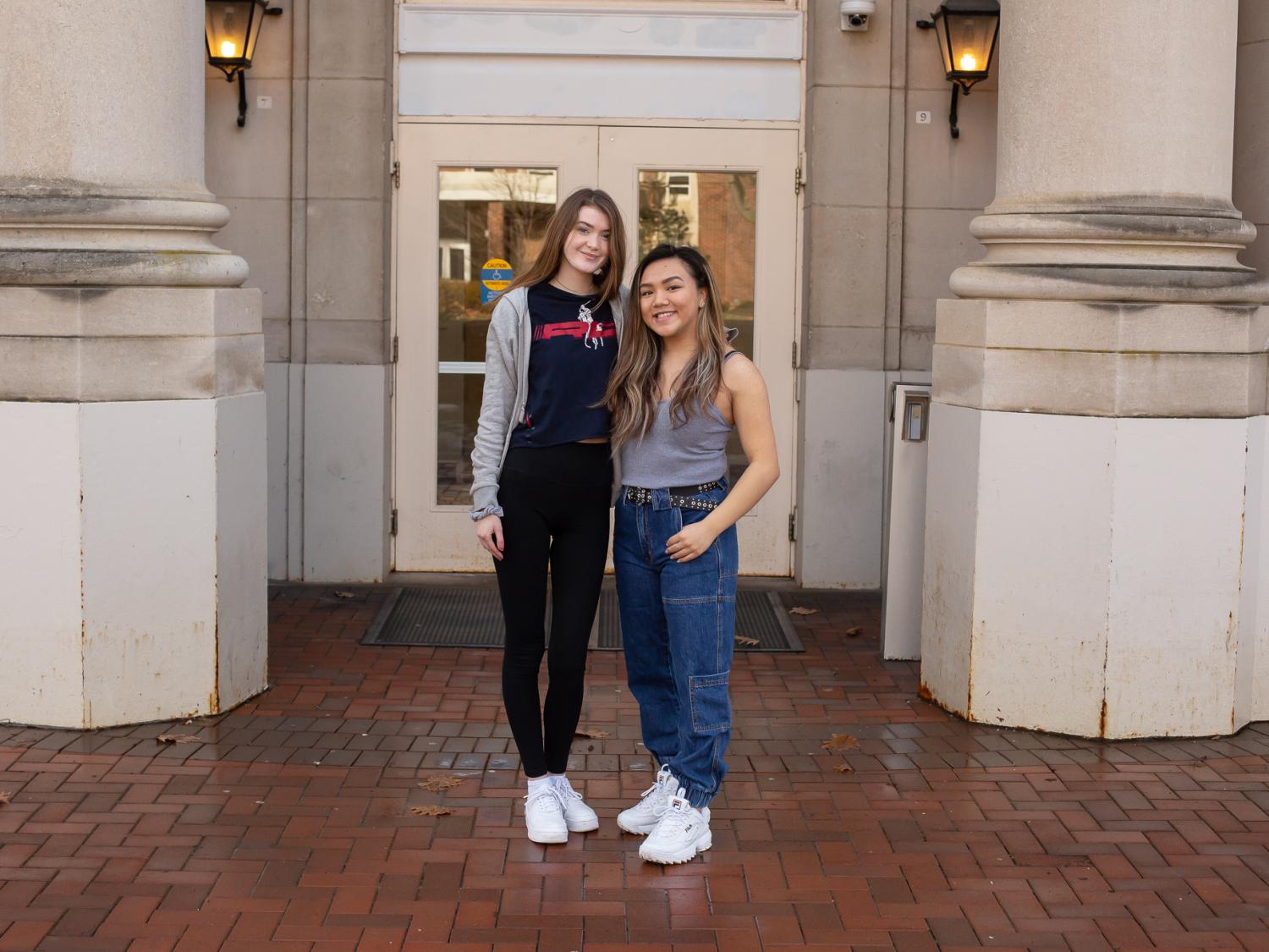 Jacqueline Siry and Megan Tam in front of the Borland Building on Campus.