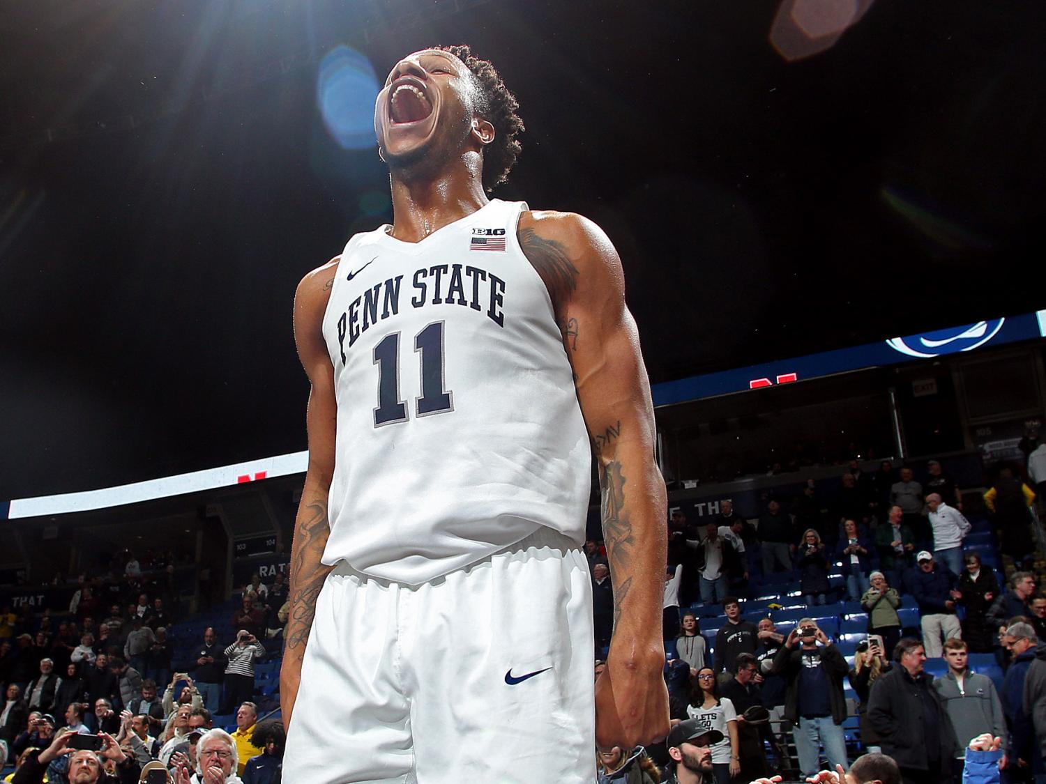 male Penn State basketball player celebrates after Big Ten win 