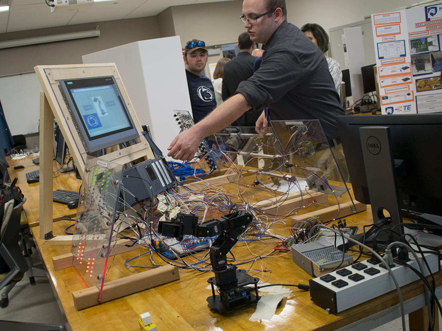 students testing circuits and wires