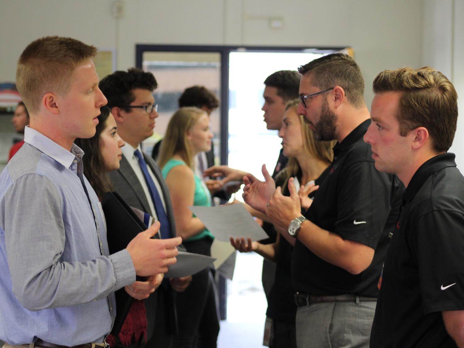 Engineering leadership development students mock interview with representatives from program sponsors. 