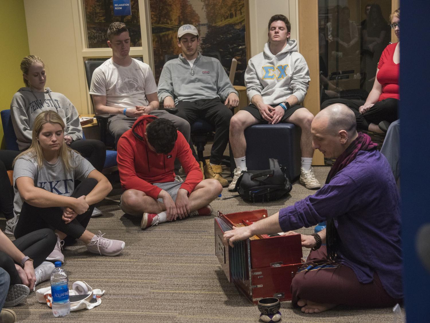 Mark Agrusti of the Dharma Lions guides students through a mindful meditation session the Wellness Suite