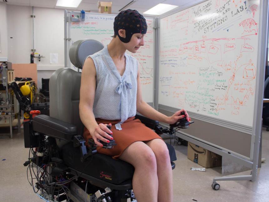 Kelilah Wolkowicz studies the robotic wheelchair she helped create.