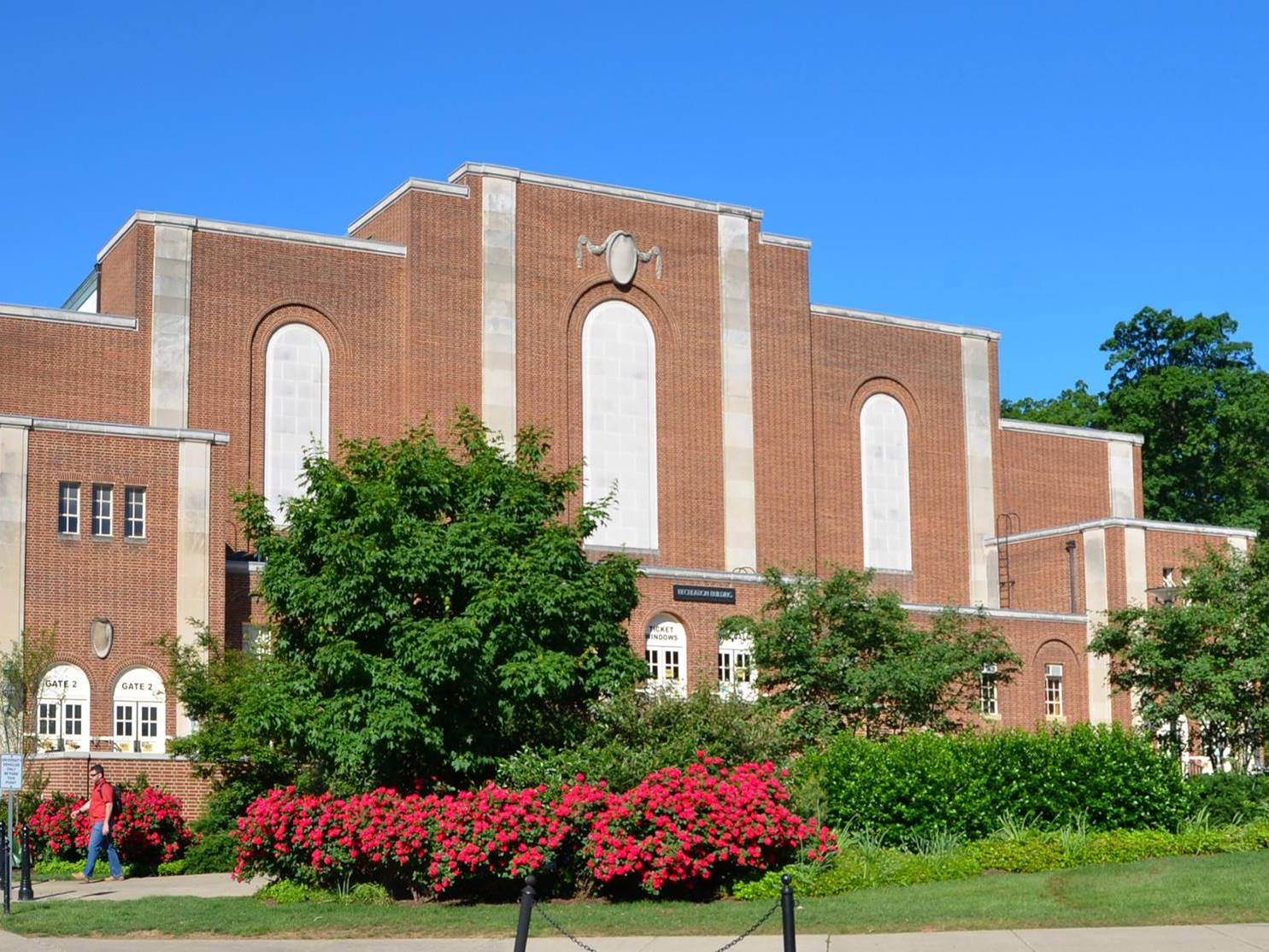 Front exterior of Rec Hall with flowers in summer