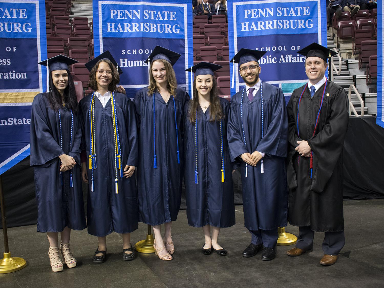 Six students in graduation regalia