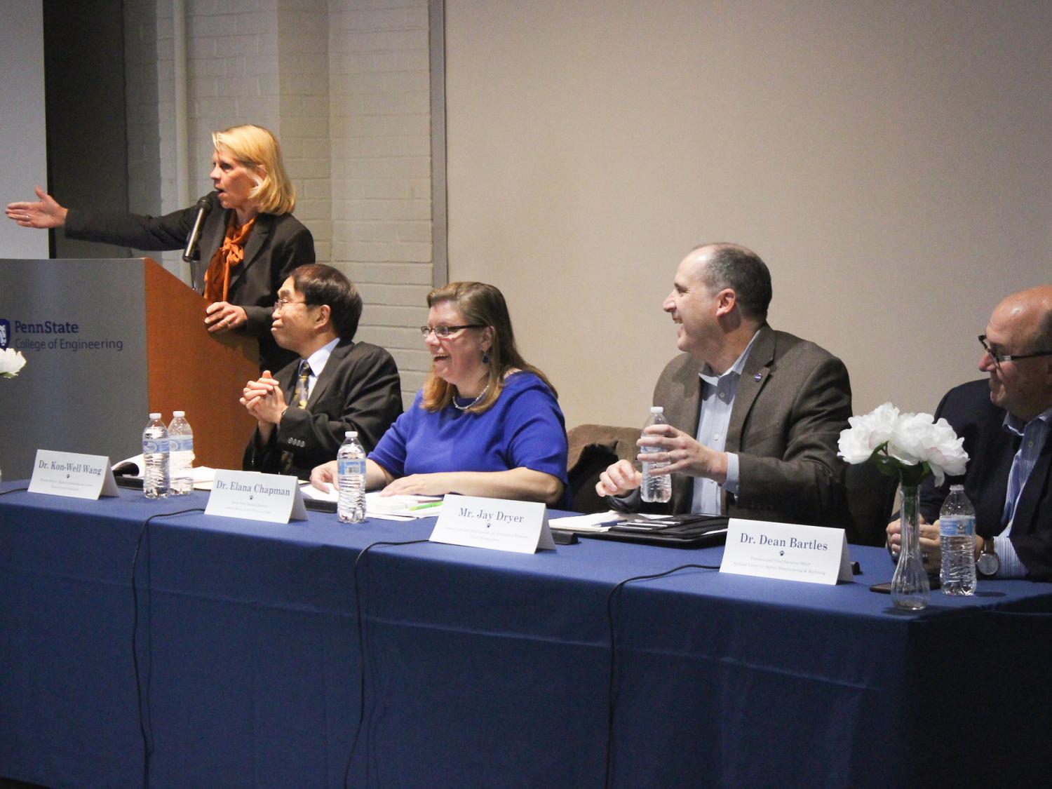 A group of mechanical engineers speak on a panel.