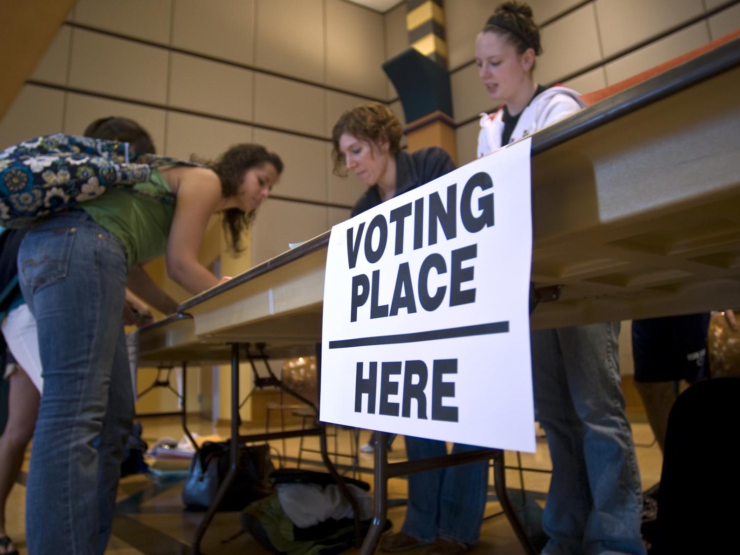 Students checking in at polling place table