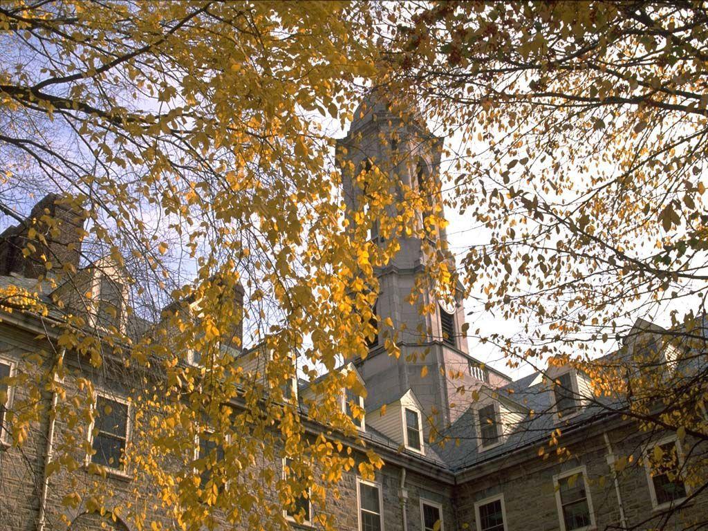 Old Main through fall leaves 