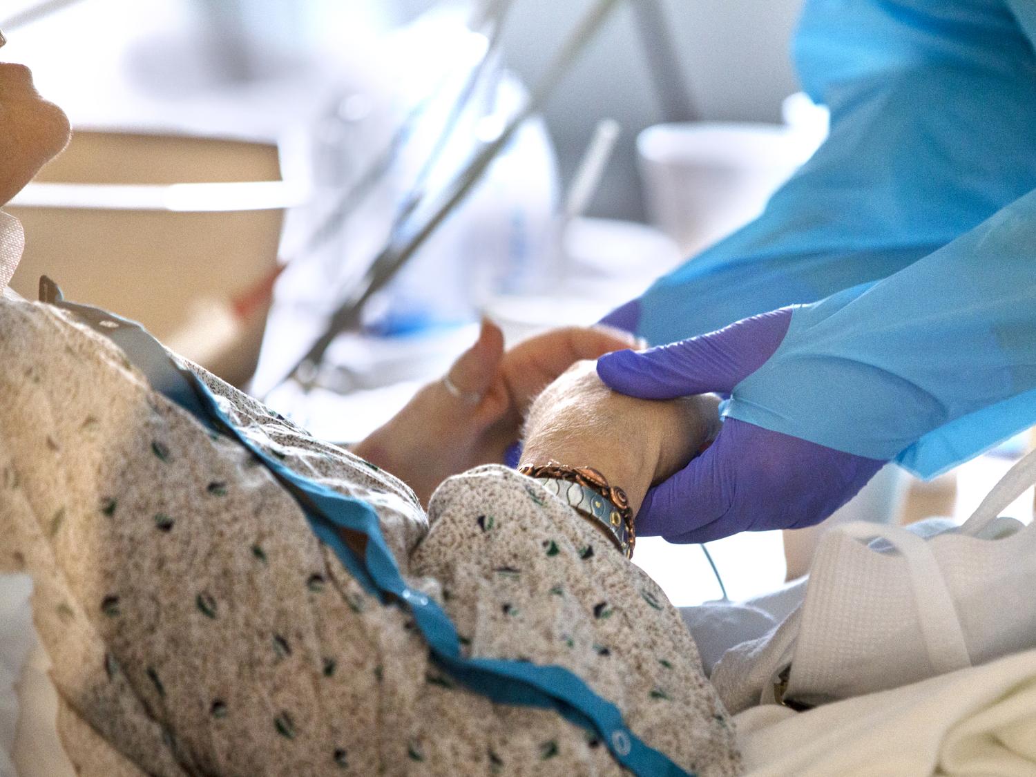 A doctor comforts a patient