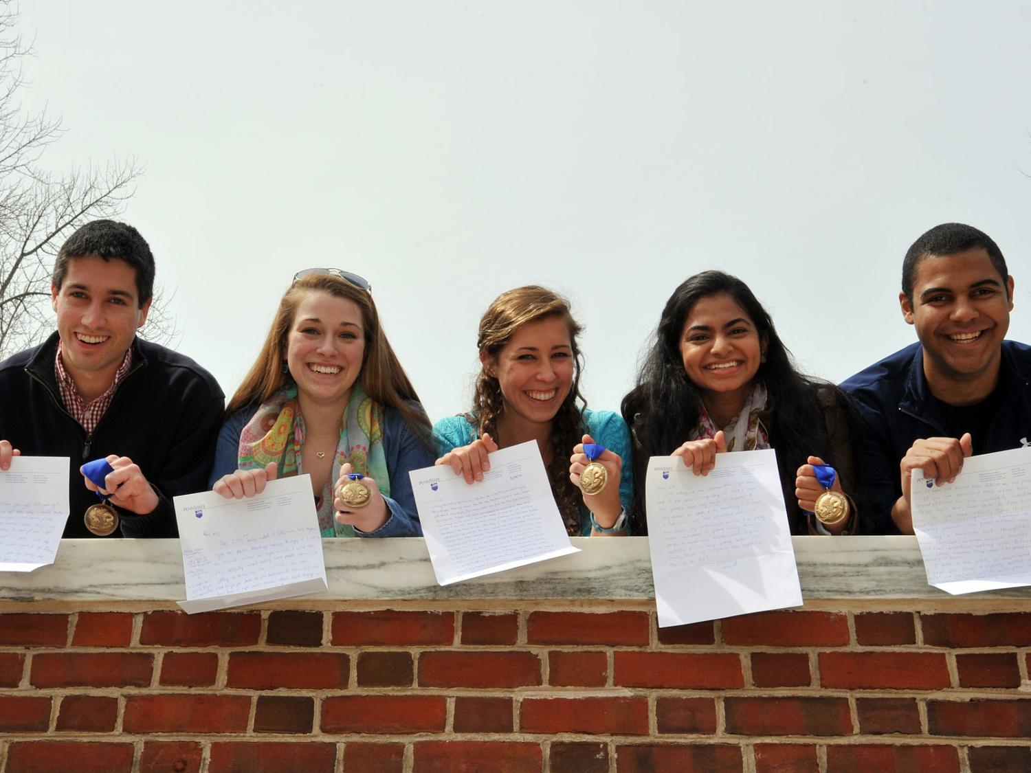 Graduating Schreyer Scholars show the letters they wrote to themselves in August 2010