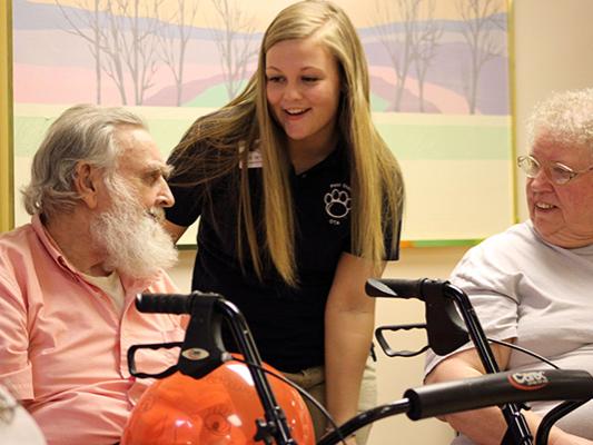 OTA student Haylee Dietrich with Trinity House Resident.