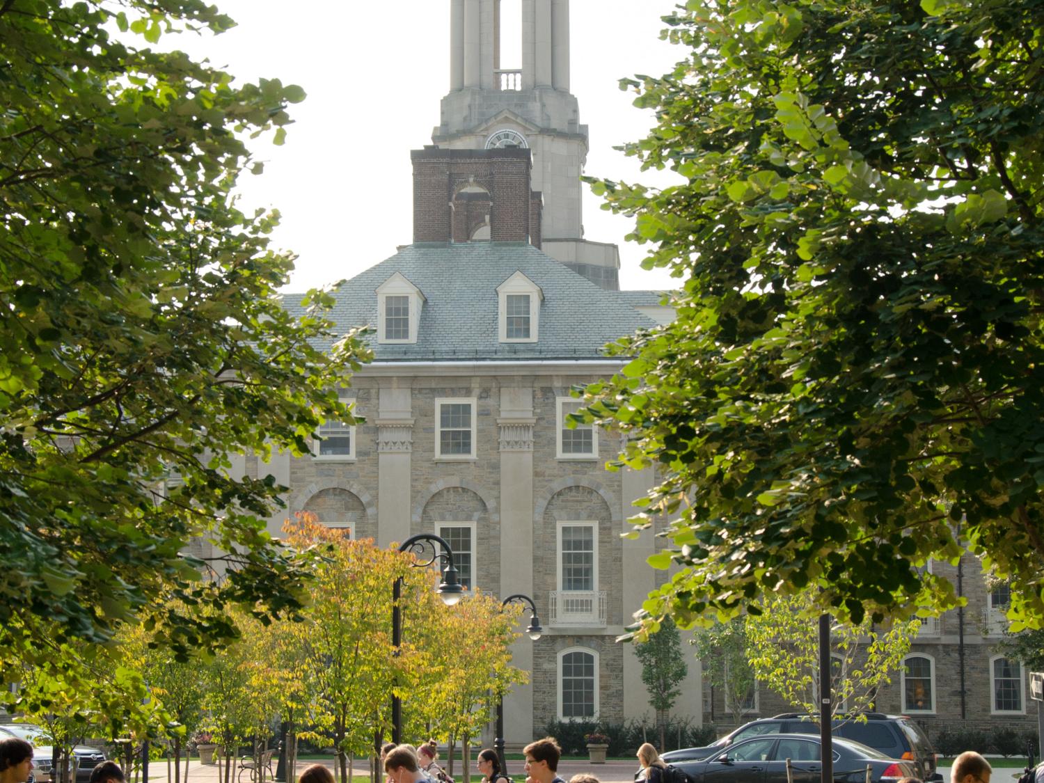 Students pass Old Main, Sept. 1, along Pollock Road.