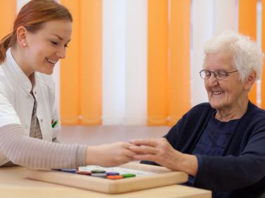 happy young and old woman playing game