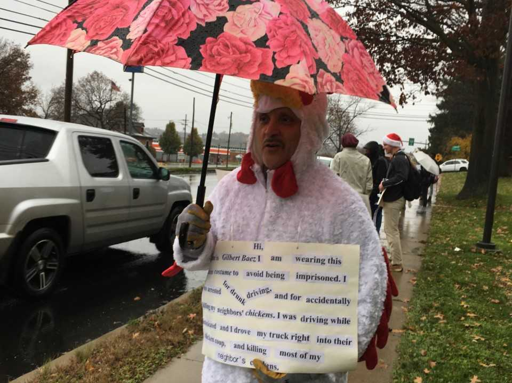 Students displayed signs along Route 255 in front of campus during a reintegrative shaming exercise. 