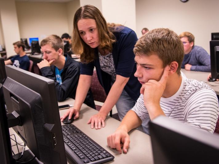 A professor instructs students during a digital art class at Penn State Behrend.