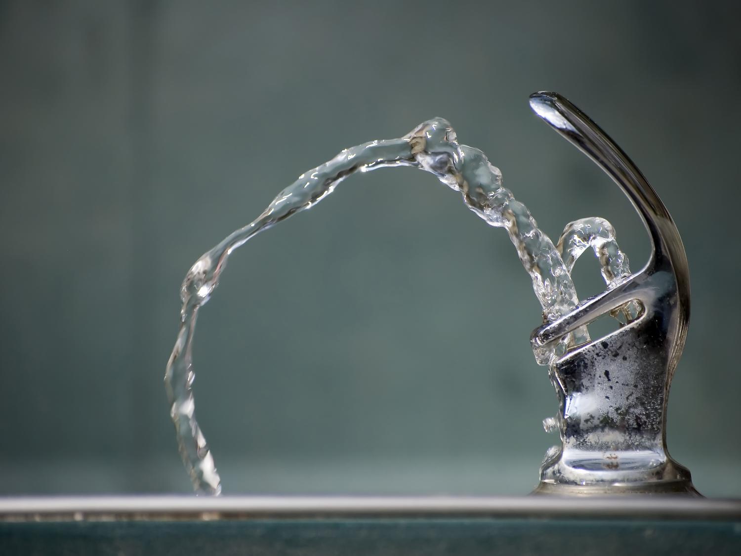 Water dispensing from a drinking fountain