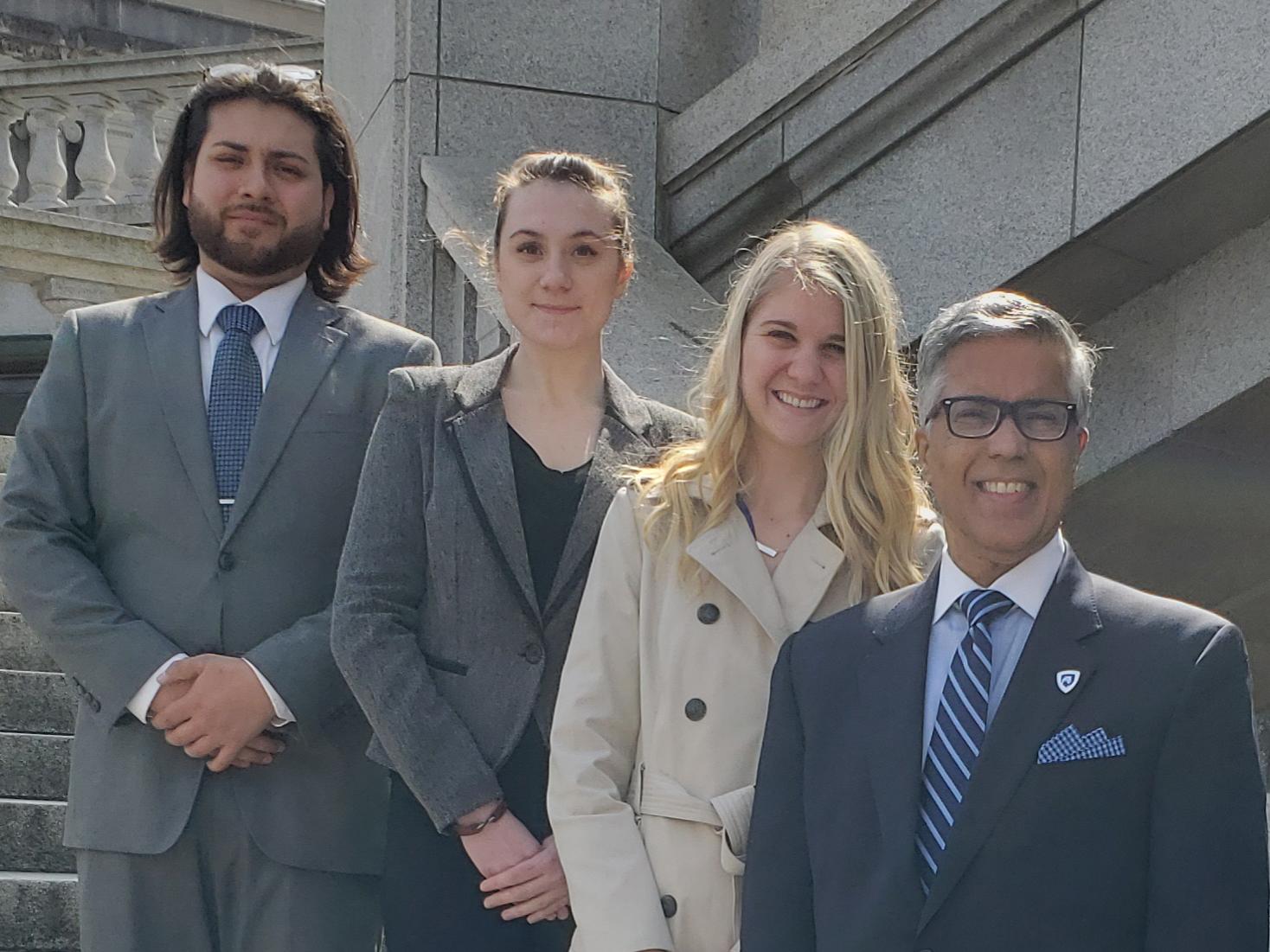 Dr. Dale Jones, chancellor of Penn State Wilkes-Barre, and three students on stairs of capitol building