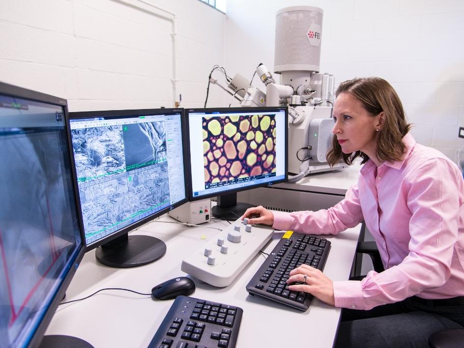 Penn State Behrend assistant professor Alicyn Rhoades works on the colleges environmental scanning electron microscope.